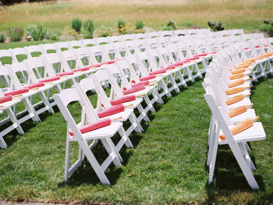 Pink and orange parasols on chairs