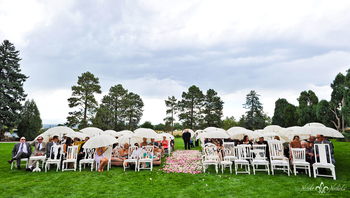 Wedding Ceremony Guests Protected with Umbrellas